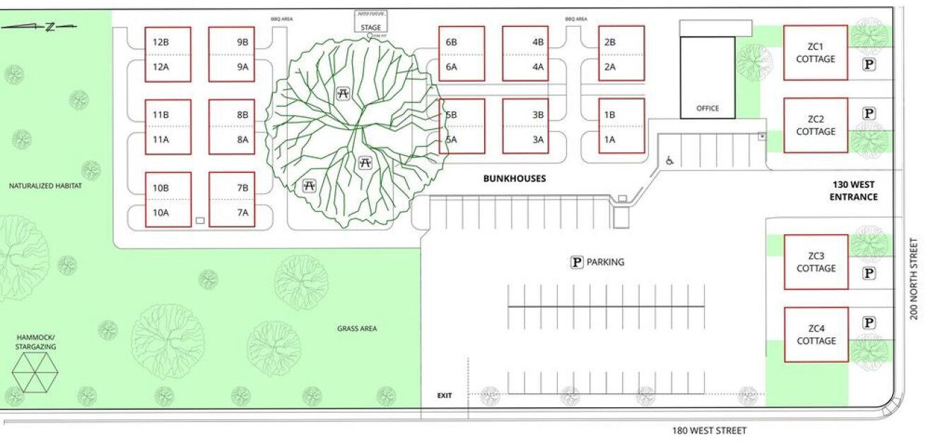 A floor plan of a hotel with bunkhouses, naturalized habitat, and a central grass area.