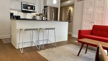 Fridge, microwave, coffee/tea maker, cookware/dishes/utensils
