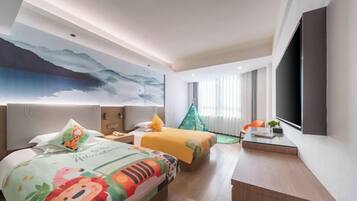 A hotel room with a large bed, a desk, a chair, a TV, and a window with curtains.