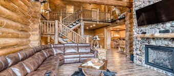 Custom riverfront log home w/ hot tub, decks & fireplace