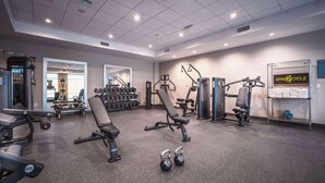 A gym with various exercise equipment, including benches, dumbbells, and weight machines. - Home2 Suites Lake Havasu City, Az (Lake Havasu City)