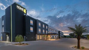 A modern hotel building with a sign reading "HOME 2" and "SUITES BY HILTON". - Home2 Suites Lake Havasu City, Az (Lake Havasu City)