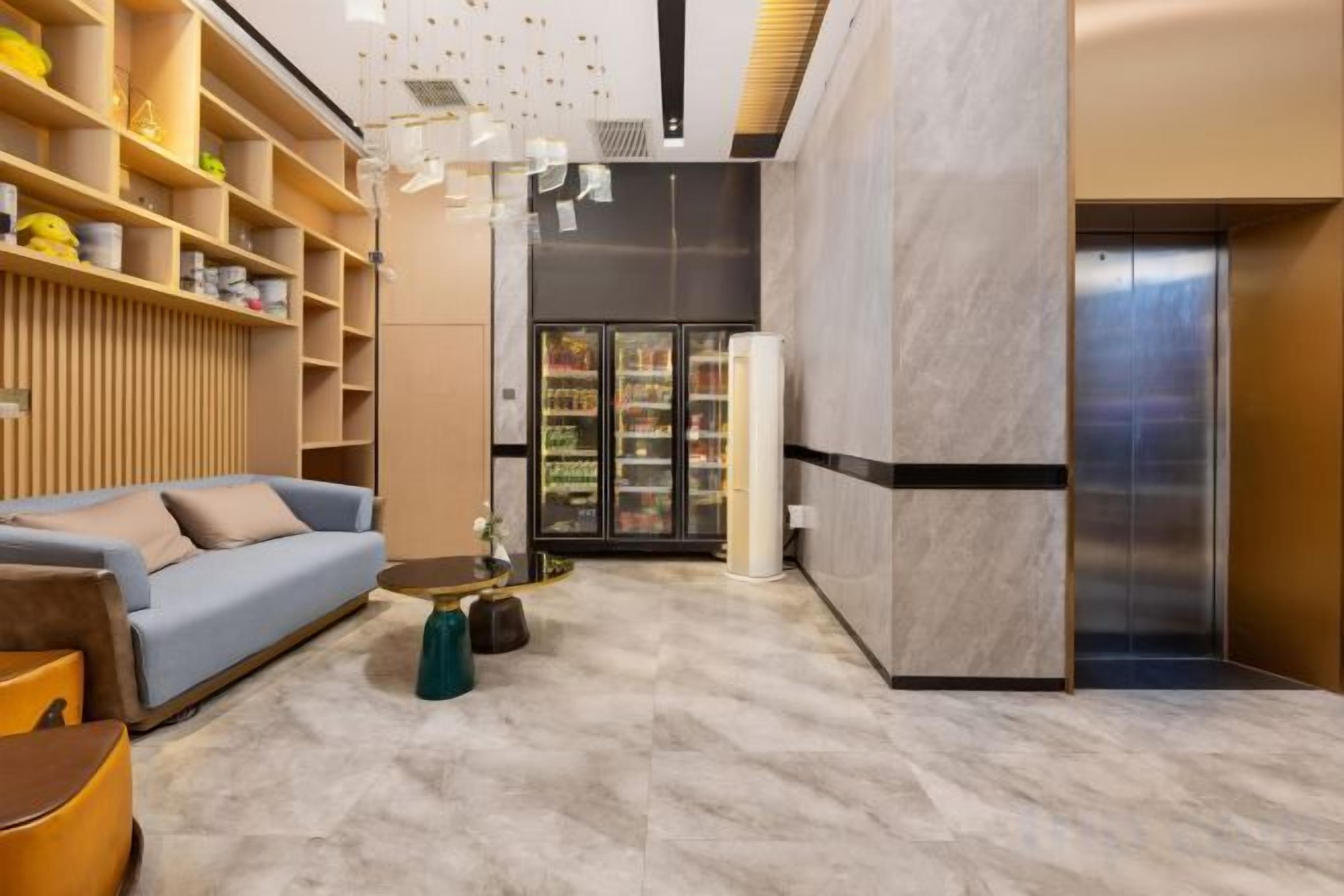 A modern interior with a sofa, coffee table, and shelves.