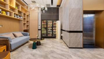 A modern interior with a sofa, coffee table, and shelves.
