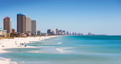 All-suite condo with Gulf views, beach access, balcony, pool, spa, gym, & AC