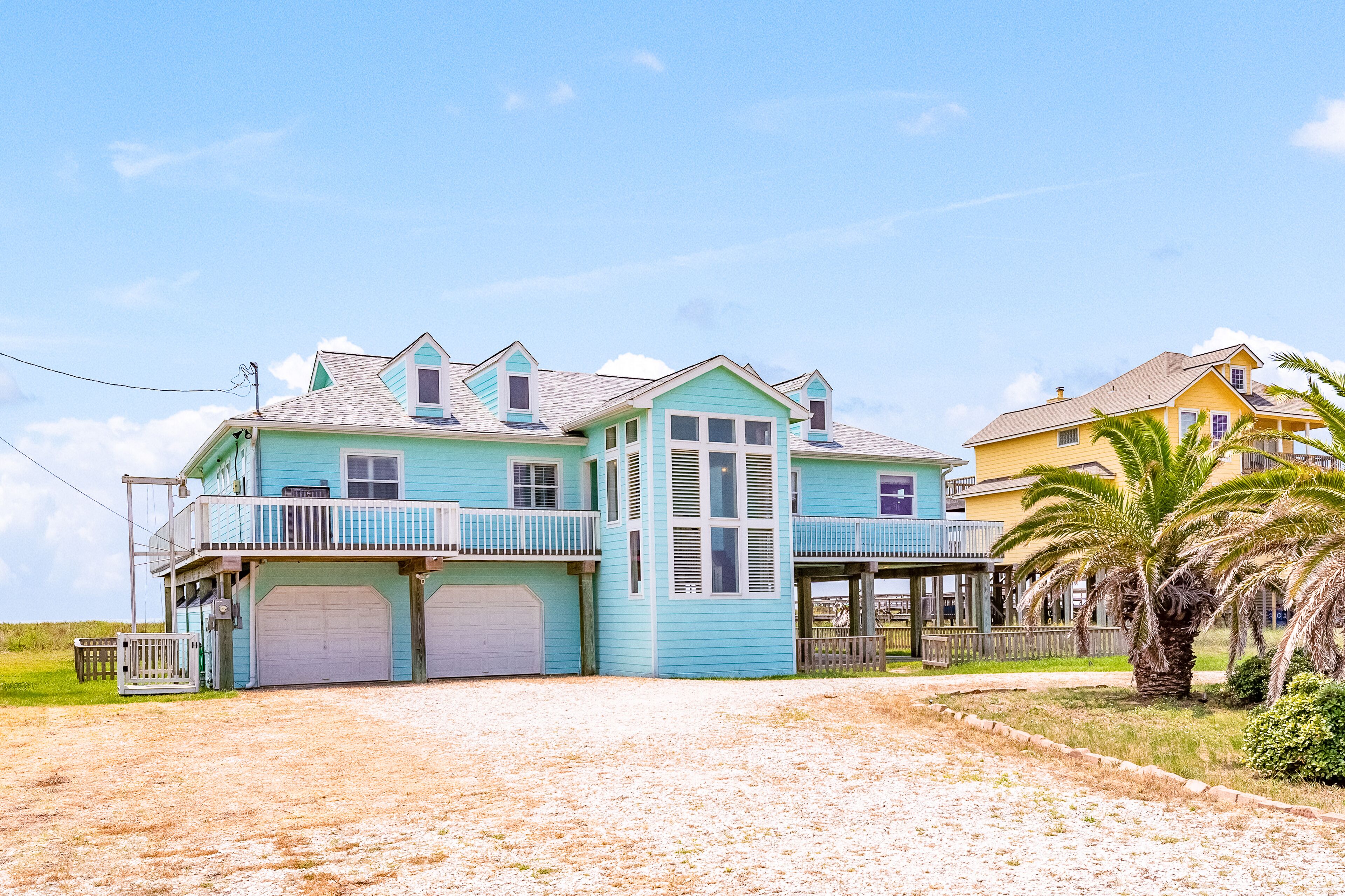 Gulf-view gem with private beach access, deck, patio, fenced yard, AC, & W/D