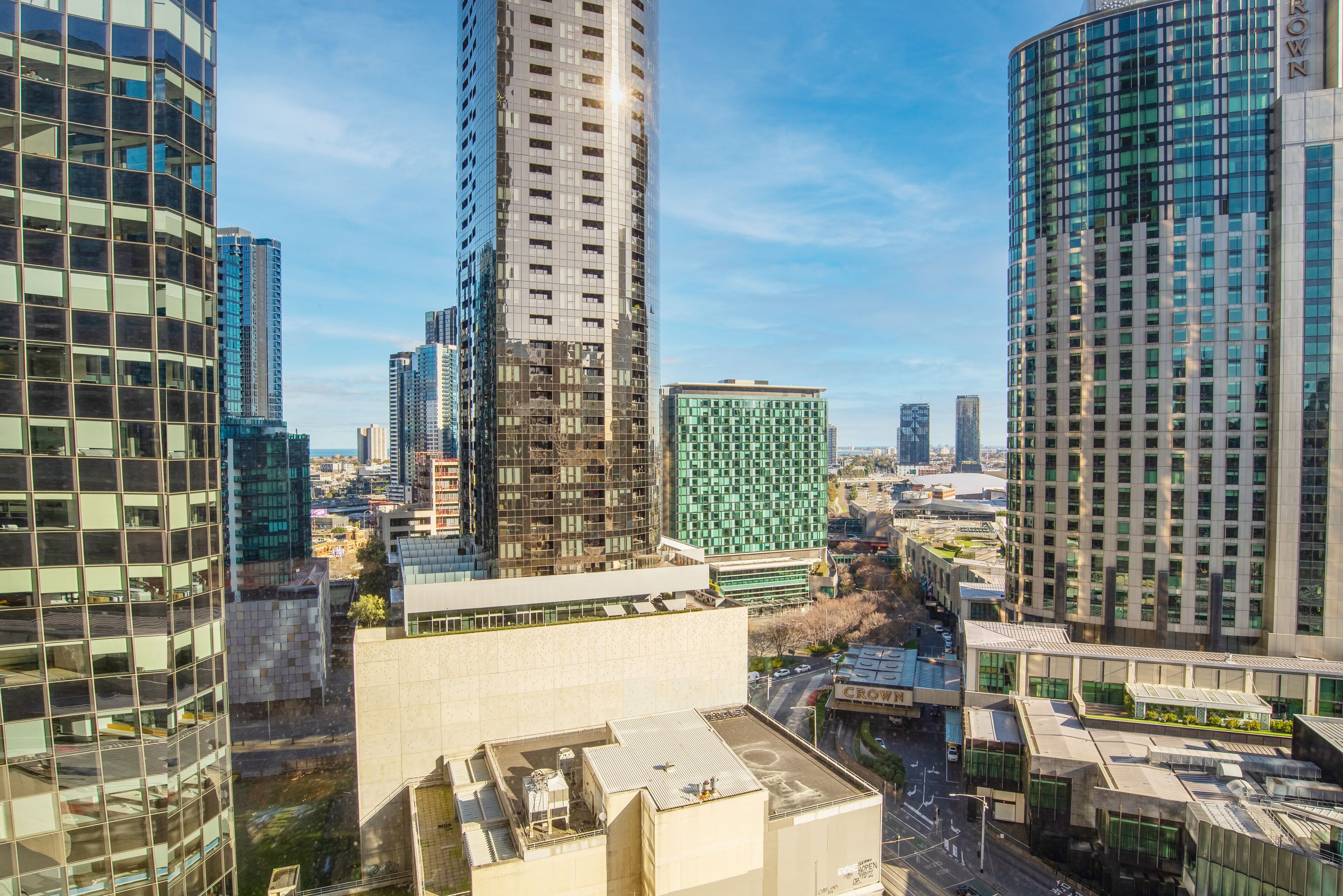 A high-rise urban area with modern architecture, including glass facades and a variety of building heights.