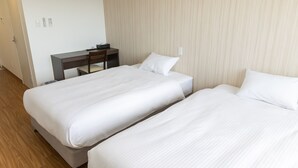 A hotel room with two single beds, a desk, and a chair. - BIBI HOTEL MIYAKO KUKOMAE (Miyakojima)