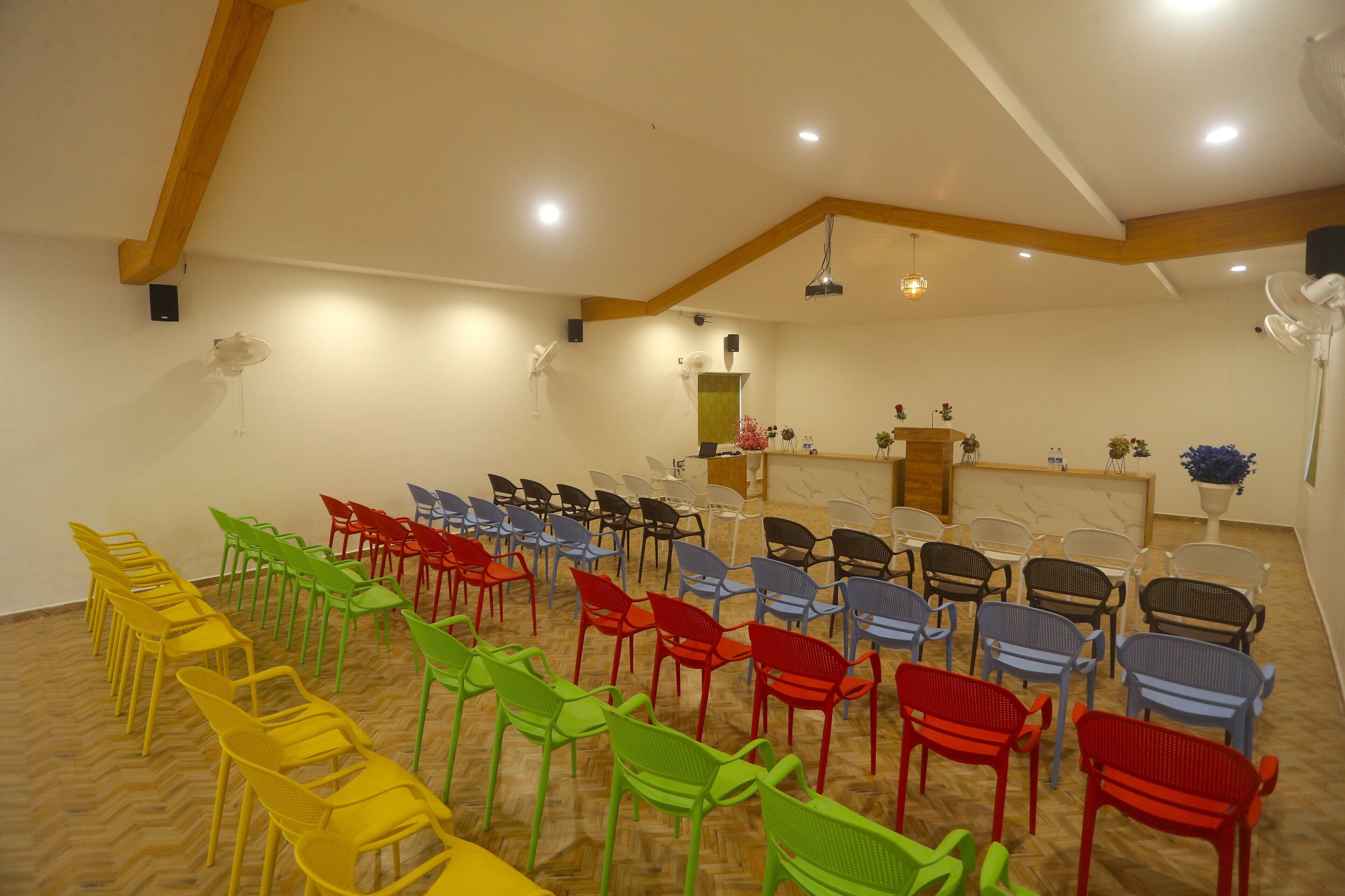 A conference room with rows of chairs arranged for an event.