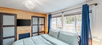 Retro-chic retreat near the beach with a fenced yard & deck, & washer/dryer