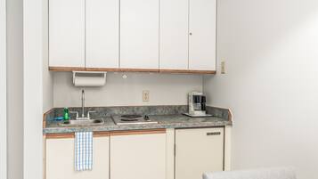 Microwave, stovetop, coffee/tea maker, cookware/dishes/utensils