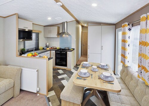 A modern holiday home with one master double and two twin bedrooms.