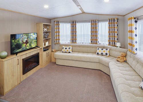 A modern holiday home with one master double and two twin bedrooms.