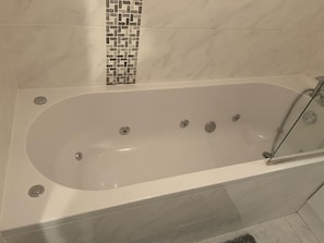 Combined shower/tub, hair dryer, towels, soap