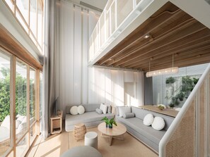 A modern living room with a grey sofa, round coffee table, and a staircase with a woven railing. - sala bang pa-in, a Member of Design Hotels (Bang Pa-in)