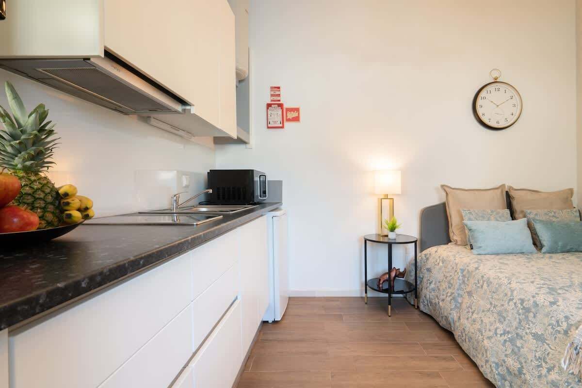 Fridge, microwave, stovetop, coffee/tea maker