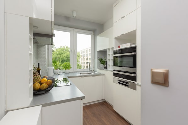 Dishwasher, coffee/tea maker, cookware/dishes/utensils