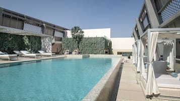 Outdoor pool, pool umbrellas, sun loungers