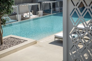 Outdoor pool, pool umbrellas, sun loungers