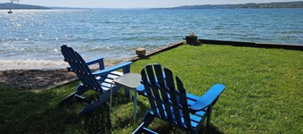 Direct Lake Leelanau sunset view, fire pit, grill, dock, boat lift, dog ok