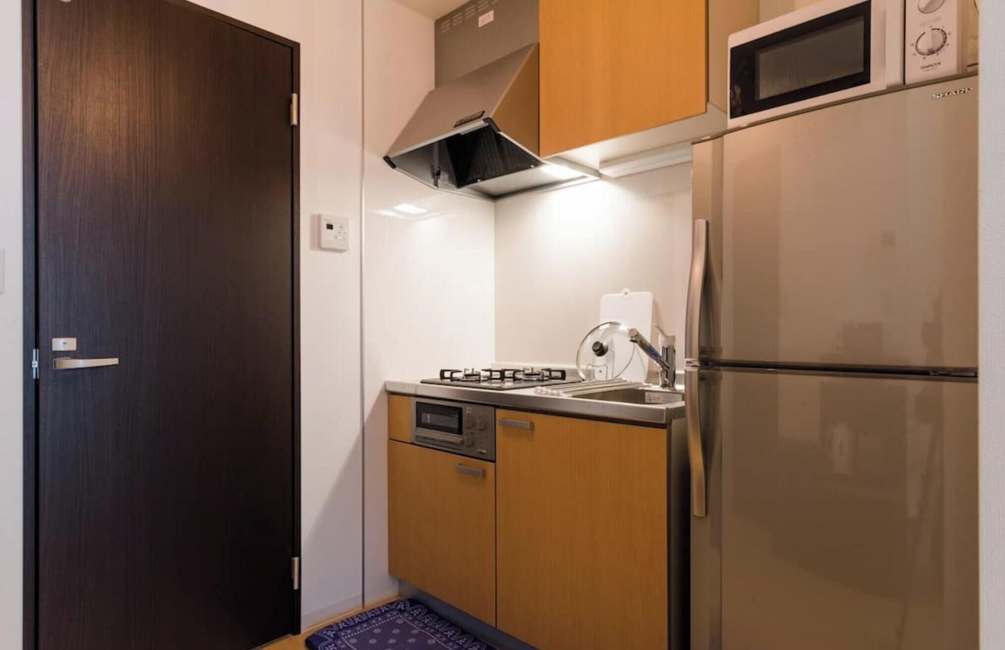 Fridge, microwave, stovetop, cookware/dishes/utensils