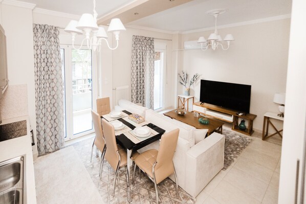 Deluxe Apartment, Multiple Bedrooms, Kitchen, City View | Living area | Flat-screen TV