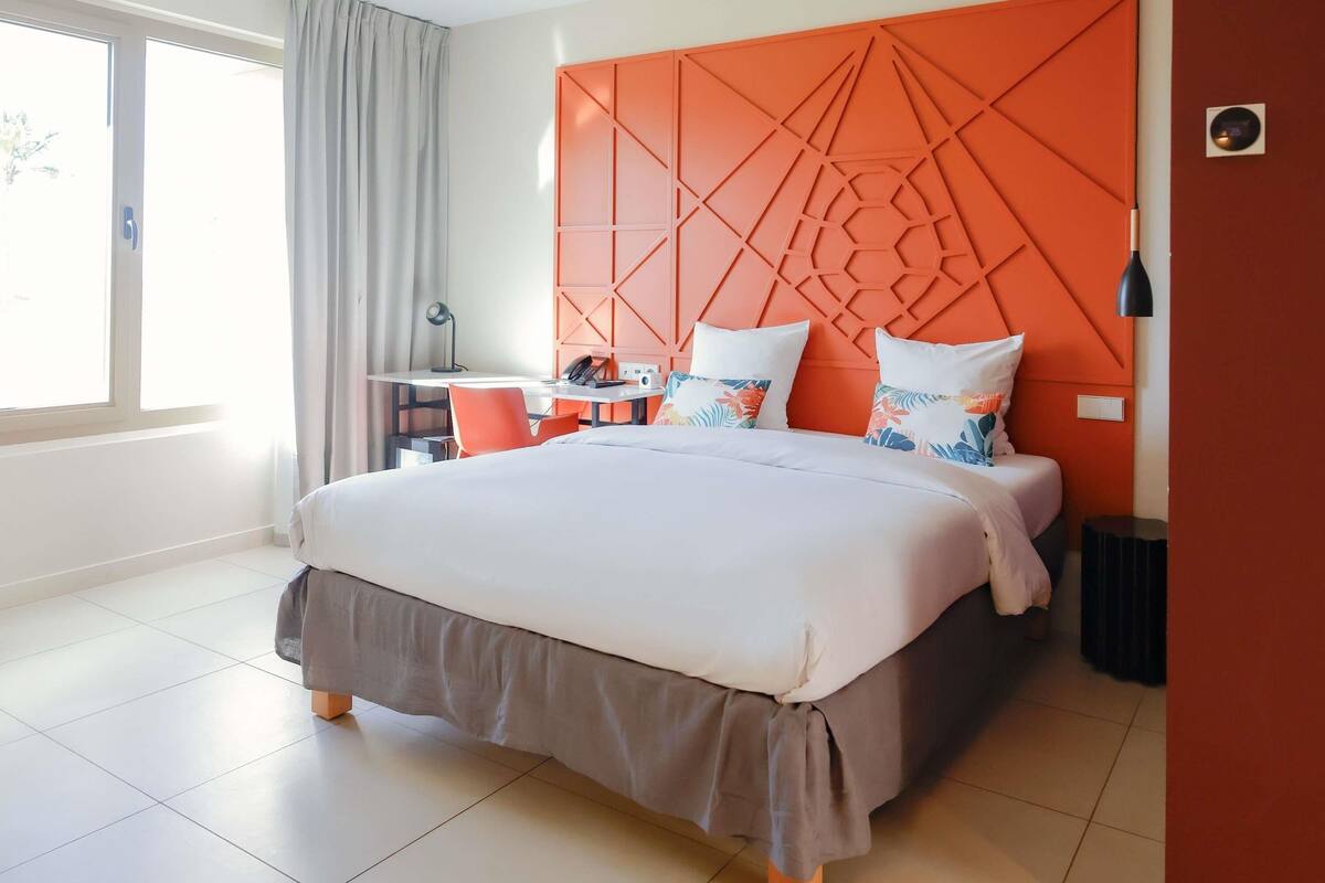 Premium bedding, down duvets, memory-foam beds, in-room safe
