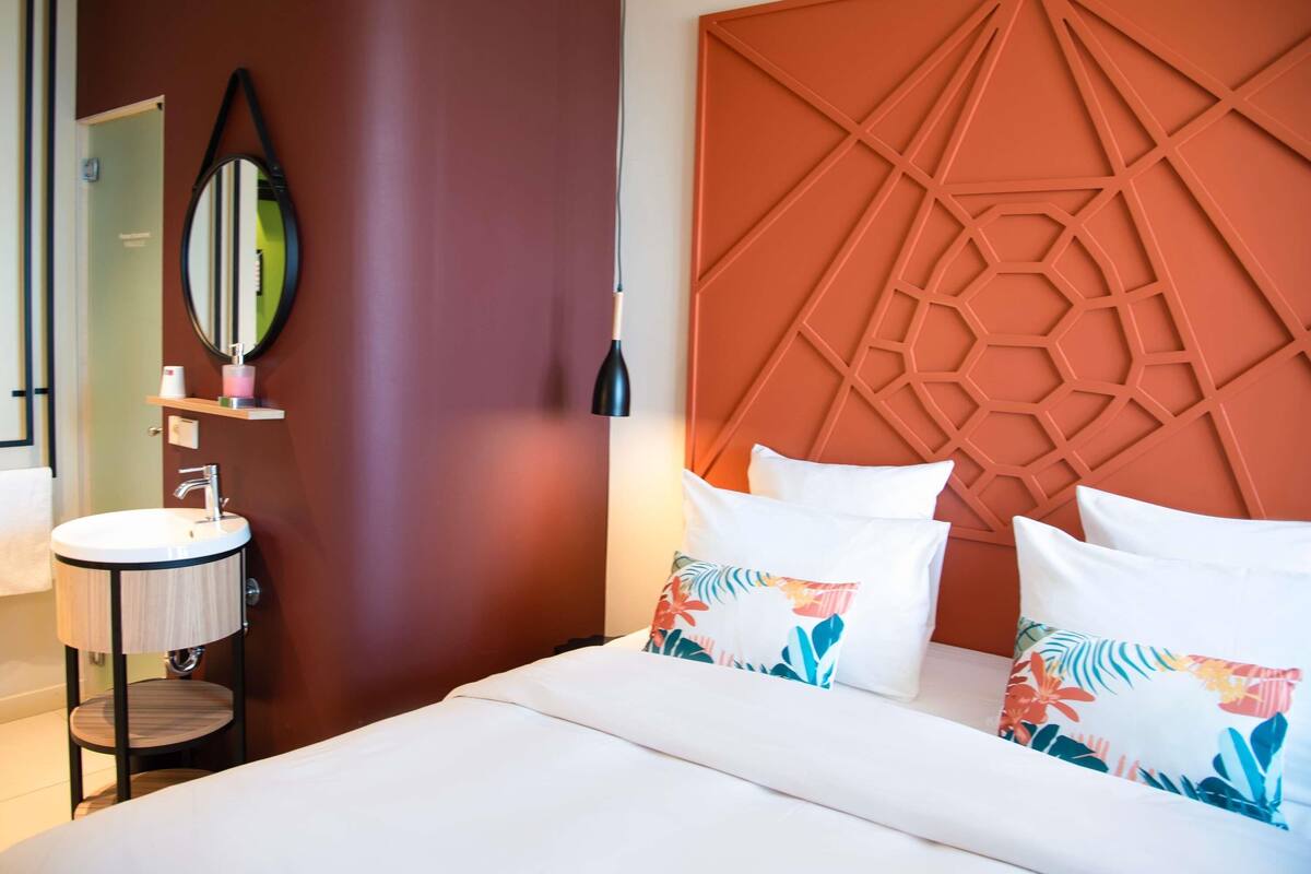 Premium bedding, down duvets, memory-foam beds, in-room safe