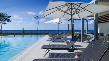 Outdoor pool, pool umbrellas, pool loungers