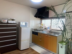 Fridge, microwave, stovetop, cookware/dishes/utensils