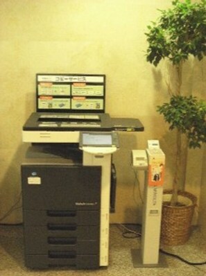 Work in comfort with a dedicated desk and computer setup, plus a printer for your needs.