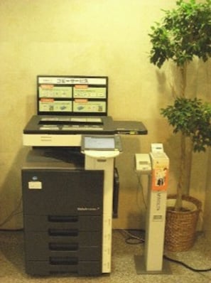 Work in comfort with a dedicated desk and computer setup, plus a printer for your needs.