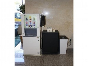 Compact suite with a kitchenette, refrigerator, and microwave, ideal for short stays or budget-conscious travelers.
