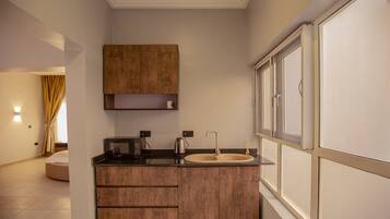 Suíte real | Cozinha americana privada