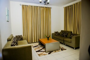 Family Room | In-room safe, desk, laptop workspace, soundproofing - ONE CLICK HOTEL (Kigali)
