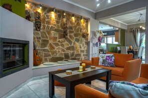 Basic House | Living area | 50-inch Smart TV with digital channels, TV, fireplace - Filios Villa (Zakynthos)