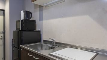 Fridge, microwave, cookware/dishes/utensils