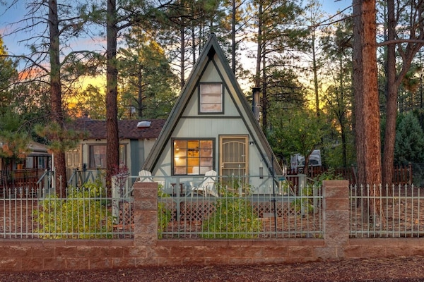 Classic A-Frame set amongst tall pines on a quiet street