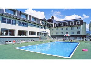 Guests can enjoy a refreshing swim in the hotel's large pool surrounded by a spacious deck area.