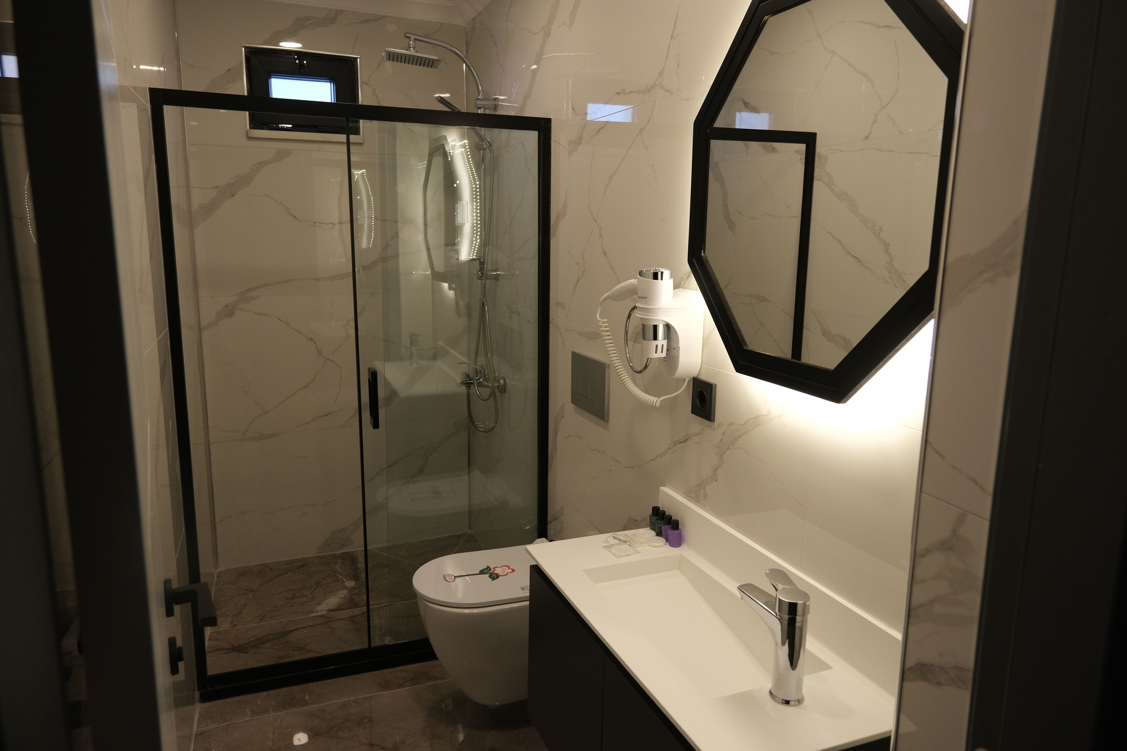 classic triple room | bathroom | shower, rainfall showerhead, hair dryer, slippers