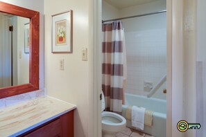 Combined shower/bathtub, hair dryer, towels, toilet paper