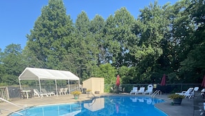 A swimming pool with a white canopy and lounge chairs. - Mountainside Chalet (#141A) - Close to Resort lodge | Great view of valley & golf course! (Basye)