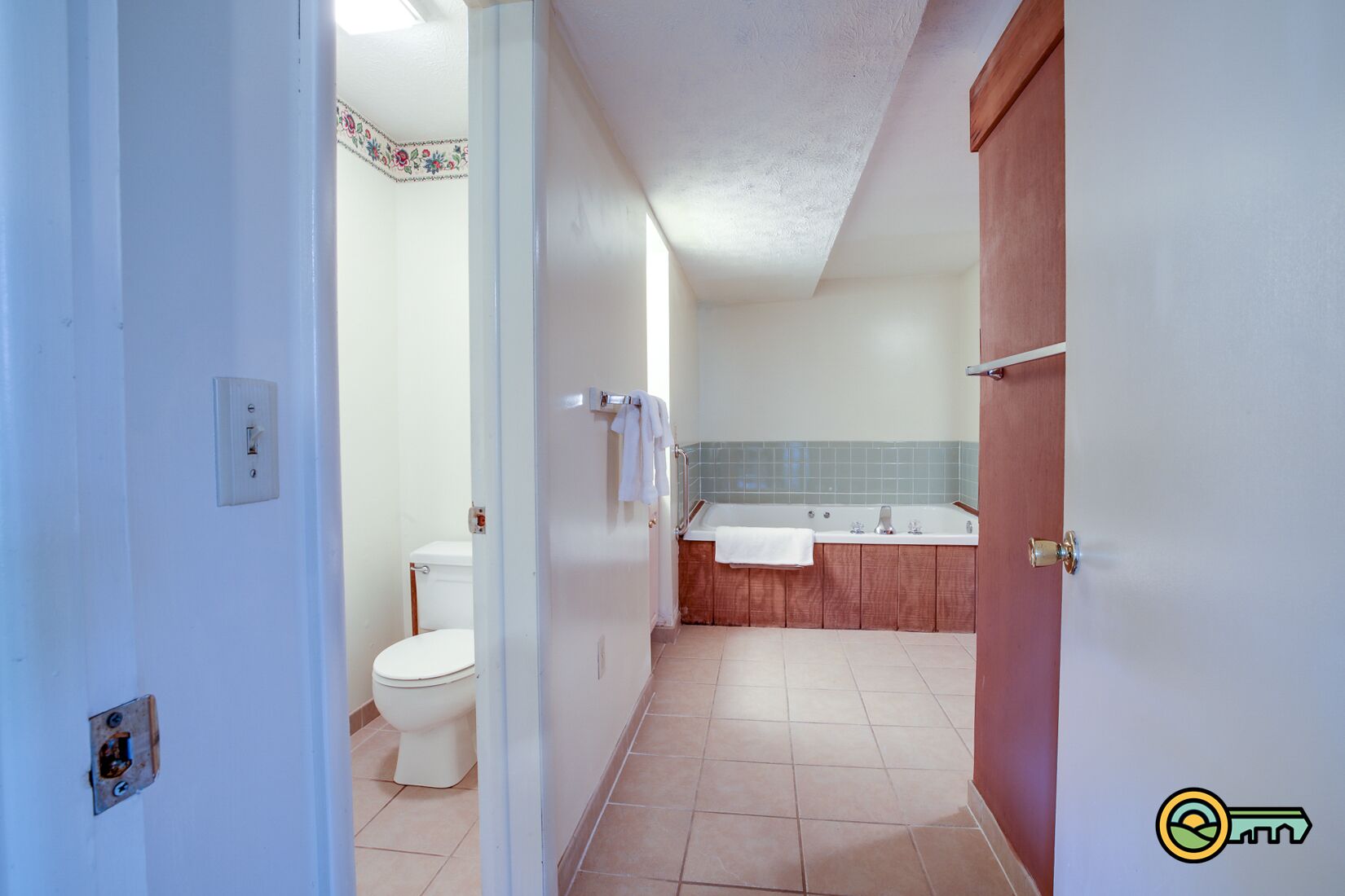 A bathroom with a toilet, sink, and bathtub.