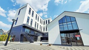 Stylish building with a prominent staircase and geometric design.