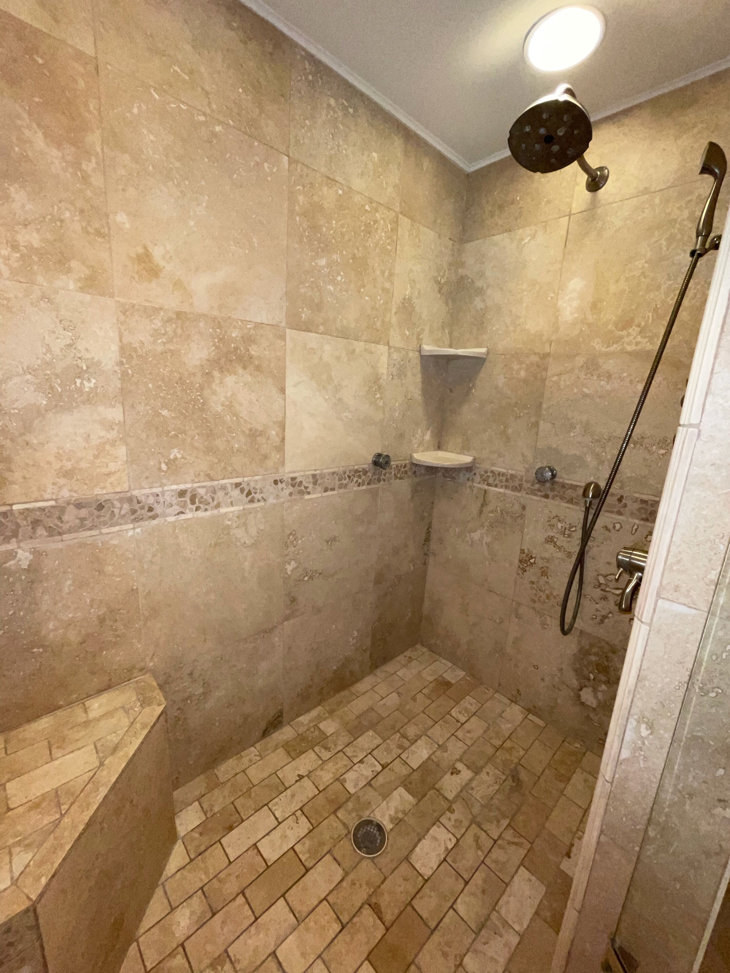 Combined shower/tub, hair dryer, towels, toilet paper
