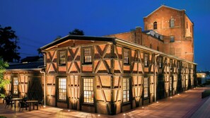 A historic building with exposed brickwork and timber framing, featuring large windows and a prominent tower. - Semidouble room Smoking allowed Narrow double / Handa Aichi (Handa)