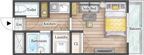 Pianta di una camera d'albergo con bagno, toilette, angolo cottura, divano letto, balcone e lavanderia.