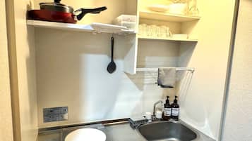 Fridge, microwave, stovetop, cookware/dishes/utensils