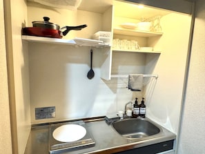 Fridge, microwave, stovetop, cookware/dishes/utensils