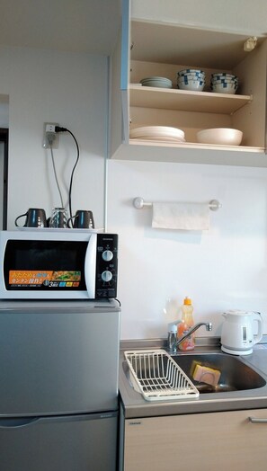 Fridge, microwave, cookware/dishes/utensils